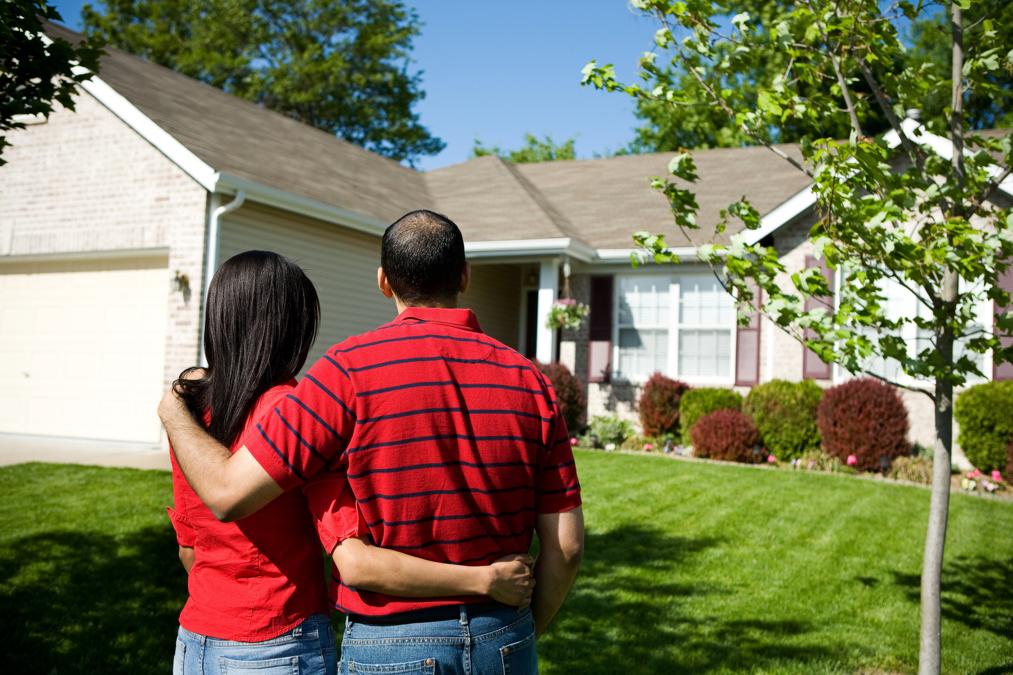 Couple admiring their brand new roof | Residential Roofing