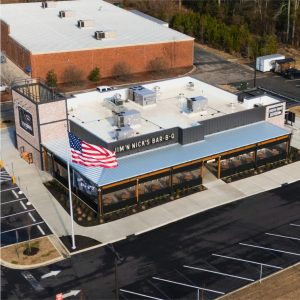 Jim 'n Nicks BBQ Restaurant Roof | Flat Roofing | Low Slope Roofing | Metal Roofing | Commercial Standing Seam Metal Roof | Commercial Roofing Solutions | Bulloch County Commercial Roofers | New Construction Commercial Roofer