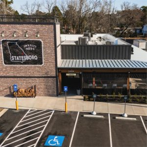 Jim 'n Nicks BBQ Restaurant Roof | Flat Roofing | Low Slope Roofing | Metal Roofing | Commercial Standing Seam Metal Roof | Commercial Roofing Solutions | Bulloch County Commercial Roofers | New Construction Commercial Roofer
