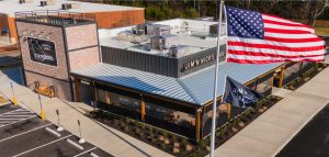 Jim 'n Nicks BBQ Restaurant Roof | Flat Roofing | Low Slope Roofing | Metal Roofing | Commercial Standing Seam Metal Roof | Commercial Roofing Solutions | Bulloch County Commercial Roofers | New Construction Commercial Roofer