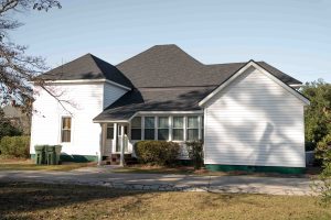 Statesboro Pathology Associates | Commercial Roofing Project After | Onyx Black Architectural Asphalt Shingles | Matte Black Standing Seam Metal Roofing
