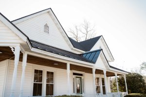 Statesboro Pathology Associates | Commercial Roofing Project After | Onyx Black Architectural Asphalt Shingles | Matte Black Standing Seam Metal Roofing