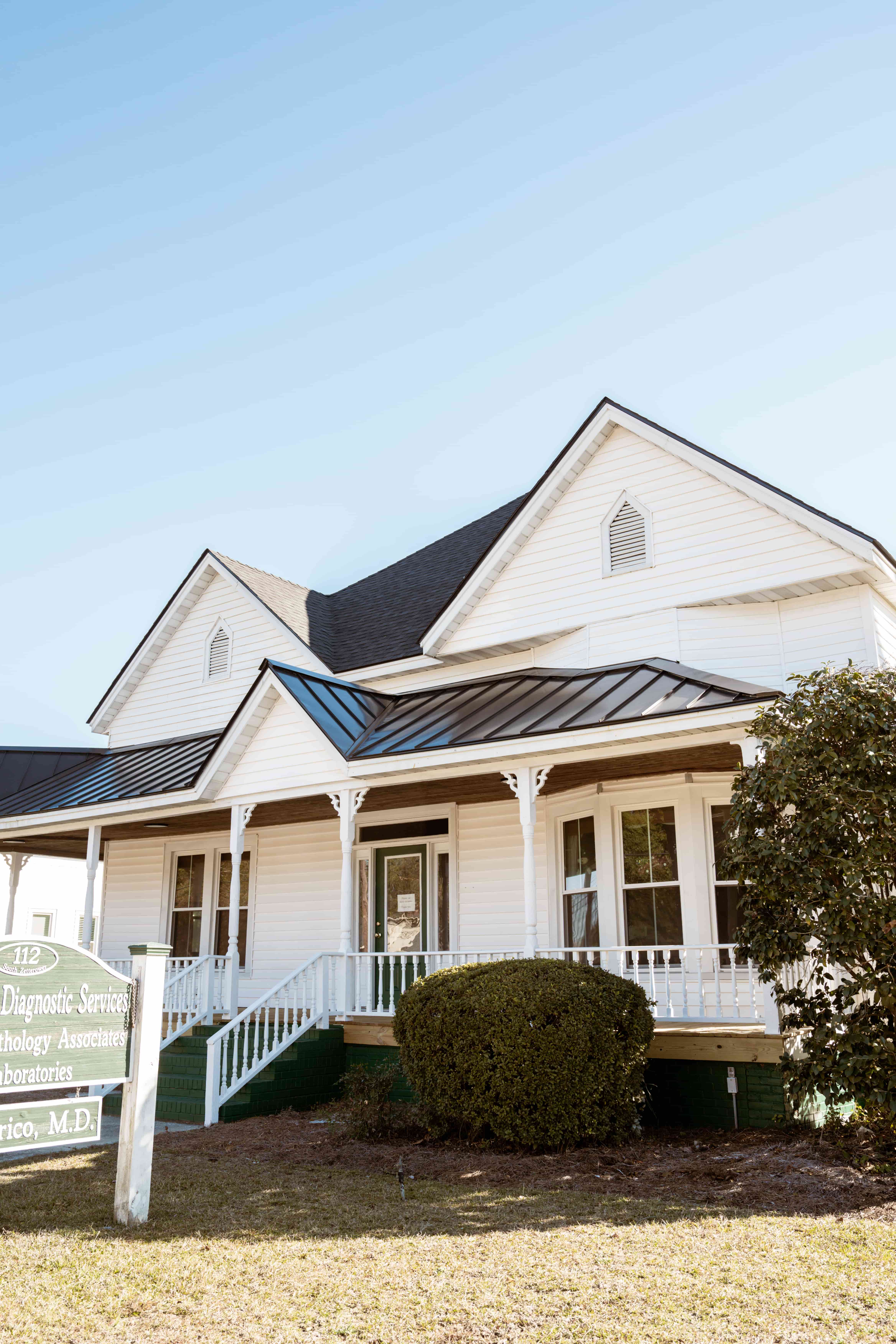 Statesboro Pathology Associates | Commercial Roofing Project After | Onyx Black Architectural Asphalt Shingles | Matte Black Standing Seam Metal Roofing