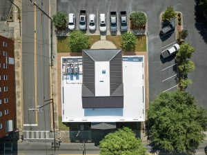 Aerial image of AgSouth Farm Credit's newly-installed, black, standing-seam metal commericial roof.