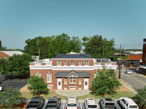 Drone image of AgSouth Farm Credit's newly-installed, black, standing-seam metal commericial roof.