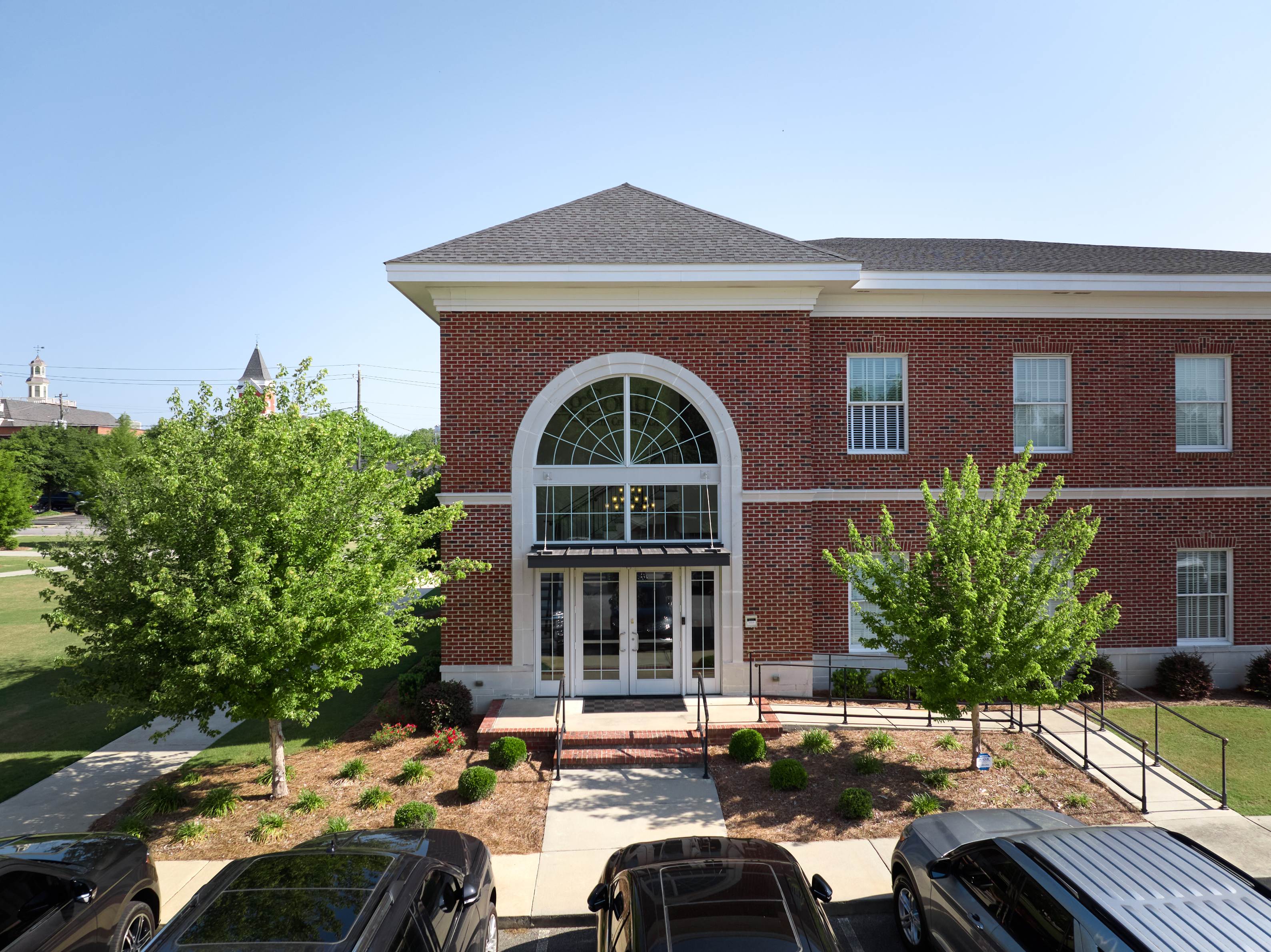 Side-angle drone image of AgSouth Farm Credit's newly-installed shingle commericial roof.