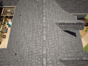 Aerial image of a residential roof with granite black aphalt shingles.